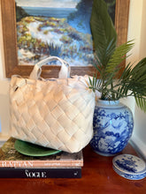 Load image into Gallery viewer, The Ruth woven neoprene ivory rectangle tote. With elbow handle and cross body removable handle. Light weight.
Stay effortlessly chic with this woven neoprene ivory rectangle tote, designed for both fashion and functionality. Crafted from lightweight yet durable neoprene, this tote features a sleek woven texture that adds a modern touch to your everyday look. The structured rectangle shape offers ample space for your essentials, while the elbow handle provides a comfortable carry option. For added versatil