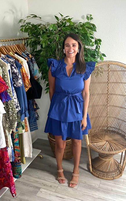 Navy Marisol tiered mini dress with double ruffle flutter sleeves and removable tie at waist. Cotton poplin.  Wearing size x-small. If bustier or between sizes, size up one size.