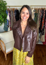 Load image into Gallery viewer, Brunette vegan leather jacket. Cropped to waistline and zipper front closure.  True to size, wearing size small.
