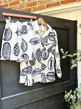 Load image into Gallery viewer, &lt;p&gt;Navy and white papaya printed short set. Elastic waist shorts with pockets and oversized button down matching shirt. Poly silk blend.&lt;/p&gt; &lt;p&gt;Wearing size small.&lt;/p&gt; &lt;p&gt;If between sizes in bottoms, size up one size.&lt;/p&gt;&lt;p&gt;Navy and white papaya printed short set. Elastic waist shorts with pockets and oversized button down matching shirt. Poly silk blend.&lt;/p&gt; &lt;p&gt;Wearing size small.&lt;/p&gt; &lt;p&gt;If between sizes in bottoms, size up one size.&lt;/p&gt;
