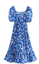 Load image into Gallery viewer, &lt;p&gt;Blue and white geometric printed ankle dress with puff sleeves, cross over bodice and drop flounce hemline. Poly silk blend.&lt;/p&gt; &lt;p&gt;Fits roomy but true to size, wearing size small.&nbsp;&lt;/p&gt; &lt;p&gt;Good for bump, post bump or no bump!&lt;/p&gt;
