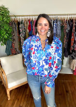Load image into Gallery viewer, Canvas floral russo long sleeve blouse. Pleated shoulders, ruffle wrists with smocking and optional front tie closure. Cotton poplin. Covers most of front and backside.  True to size, wearing size x-small.
