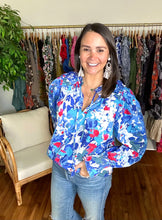 Load image into Gallery viewer, Canvas floral russo long sleeve blouse. Pleated shoulders, ruffle wrists with smocking and optional front tie closure. Cotton poplin. Covers most of front and backside.  True to size, wearing size x-small.
