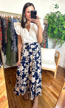 Load image into Gallery viewer, Navy Lilo night tropics Yaelle maxi skirt. Cotton poplin, tiered ankle skirt. High waisted with straight empire on front and elastic backside.  True to size, wearing size x-small.
