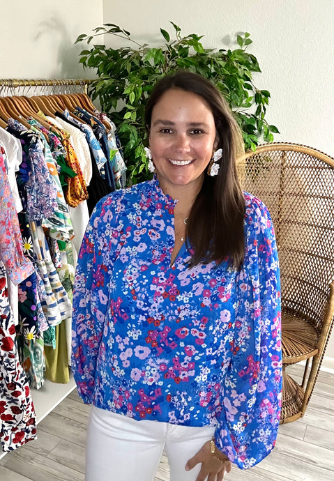 Blue, pink, red and white floral blouse with split neck and balloon long sleeves. Bodice lined and sleeves sheer. Chiffon and cotton blend. Covers most of front and rear.  True to size, wearing size x-small.