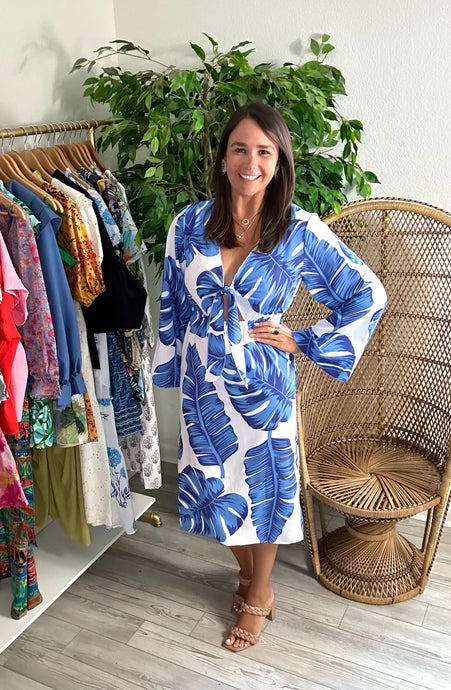 Blue and white palm printed midi dress. Long bell sleeves, tie front closure and elastic waistline. Straight skirt with back slit. Poly silk blend.  Wearing size small, if between sizes in the hips, size up 1 size.