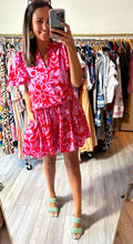 Load image into Gallery viewer, Rock a By Trapeze mini dress in magenta marina garnet floral print. Flutter sleeves with modest v-neck. Gathered high low skirt with pockets. Light weight cotton poplin.  True to size, wearing size x-small.
