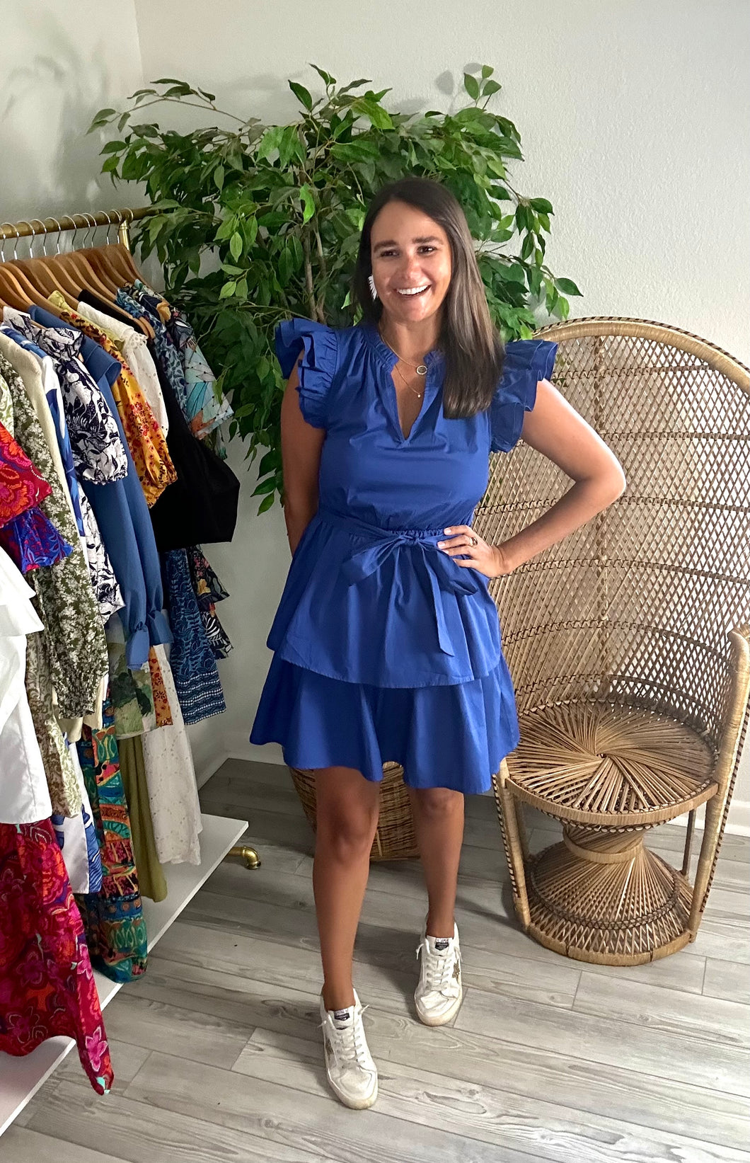 Navy Marisol tiered mini dress with double ruffle flutter sleeves and removable tie at waist. Cotton poplin.  Wearing size x-small. If bustier or between sizes, size up one size.