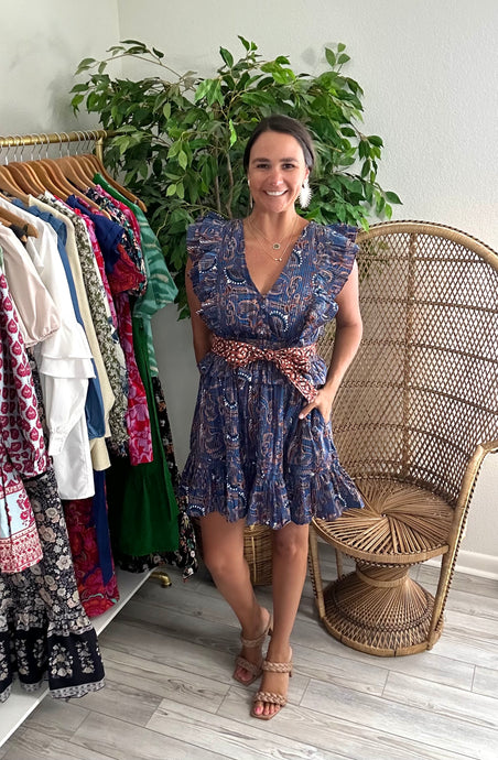 Elara mini dress in lazuli print. Double pleated flutter sleeves, elastic waist line and flounce double ruffle detailing on skirt with pockets. Cotton and double lined. Removable sash.  True to size, wearing size x-small.