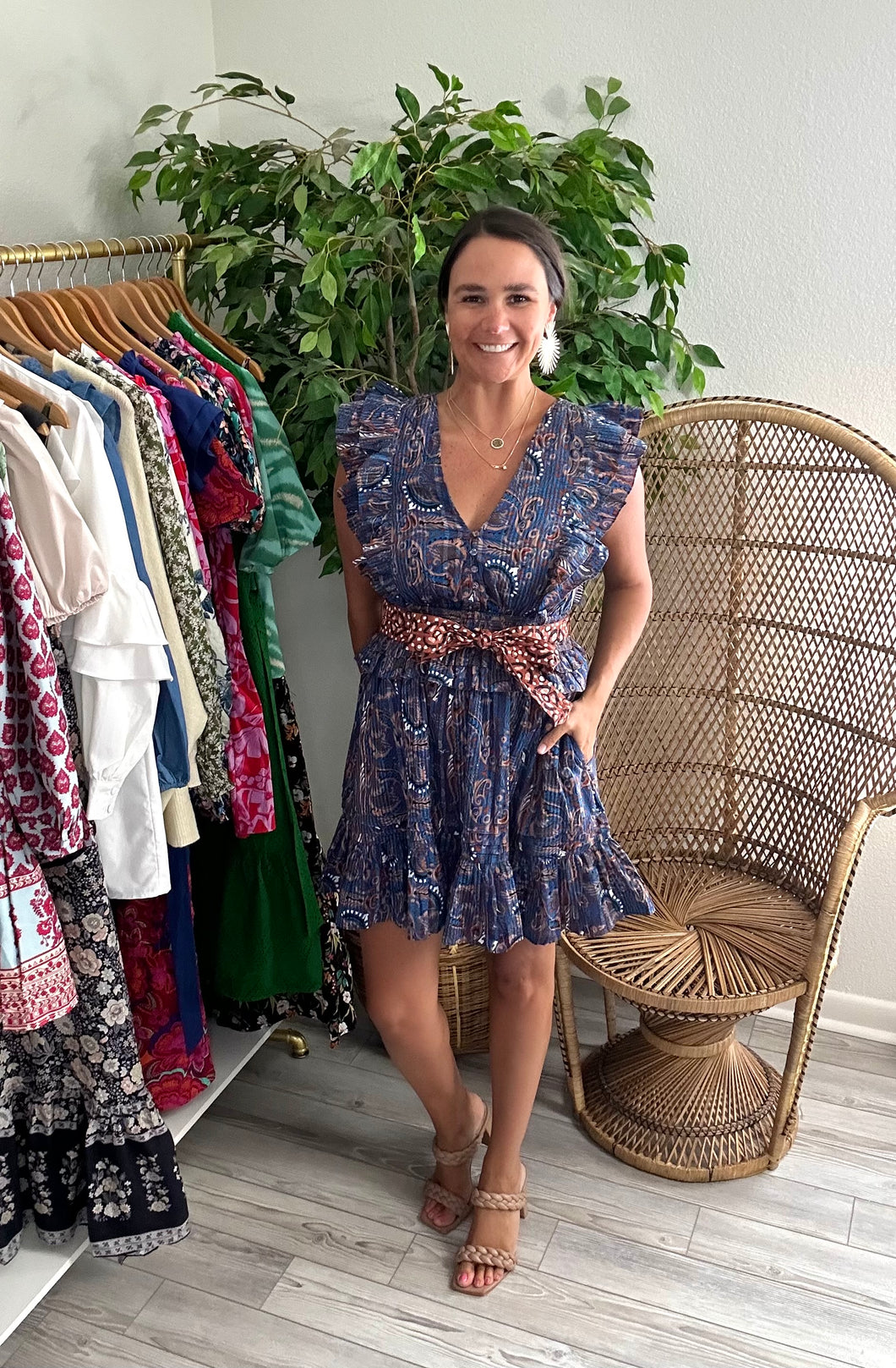 Elara mini dress in lazuli print. Double pleated flutter sleeves, elastic waist line and flounce double ruffle detailing on skirt with pockets. Cotton and double lined. Removable sash.  True to size, wearing size x-small.