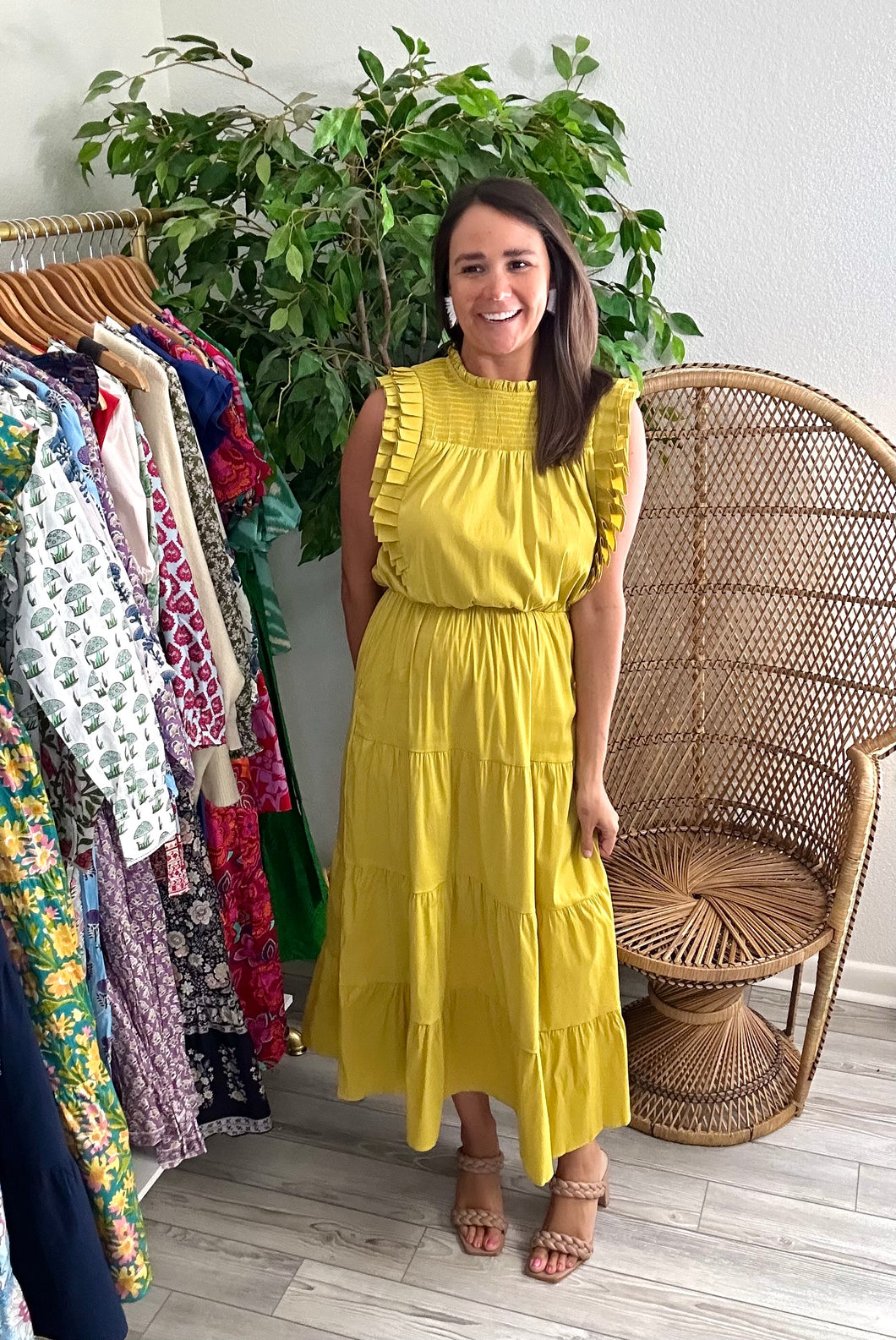 Chartreuse ankle dress with double pleated exaggerated shouldering. Smocked yoke, ruffle neckline and tiered skirt with pockets from empire waist. Poly silk and cotton poplin blend. Keyhole back closure and elastic at waist.  Fits roomy, wearing size small. If between sizes, size down.  Good for bump, post bump or no bump!