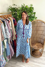 Load image into Gallery viewer, Iris print caftan. Double front tassel tie closure with modest v-neck. Pleated tiered skirt. hand block print, making each dress unique. Light weight cotton.  One size fits most, suggested 00-10, XS-L
