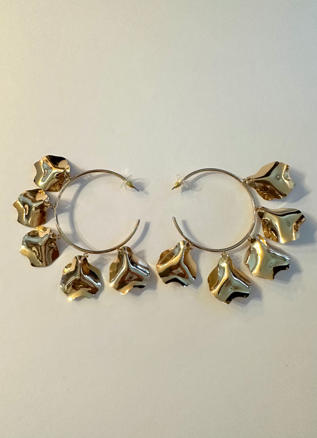 Gold petal hoops. Light weight. About 3 inches.