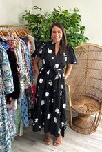Load image into Gallery viewer, Esconido tiered midi dress in flyer noir print. Flutter sleeves with ruffle detailing at shoulders. Removable tie at waist and tiered skirt with pockets. Cotton poplin.  Fits roomy, size down if between sizes. Wearing size x-small.  Good for bump, post bump or no bump!
