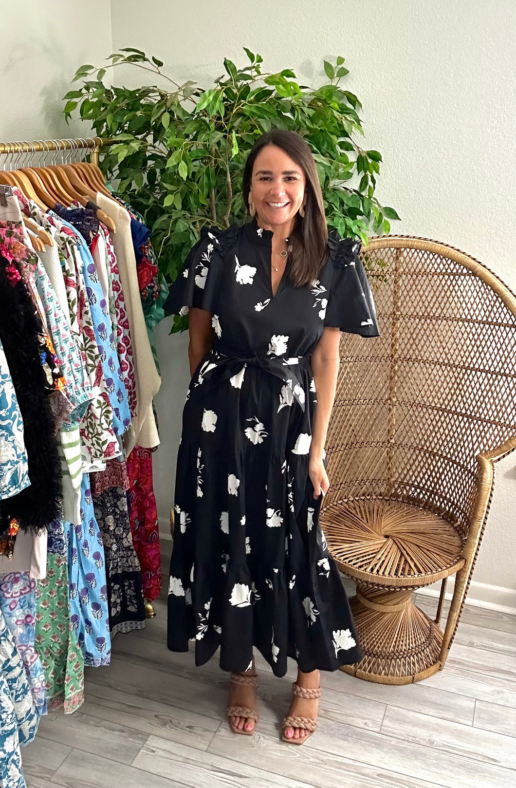 Esconido tiered midi dress in flyer noir print. Flutter sleeves with ruffle detailing at shoulders. Removable tie at waist and tiered skirt with pockets. Cotton poplin.  Fits roomy, size down if between sizes. Wearing size x-small.  Good for bump, post bump or no bump!