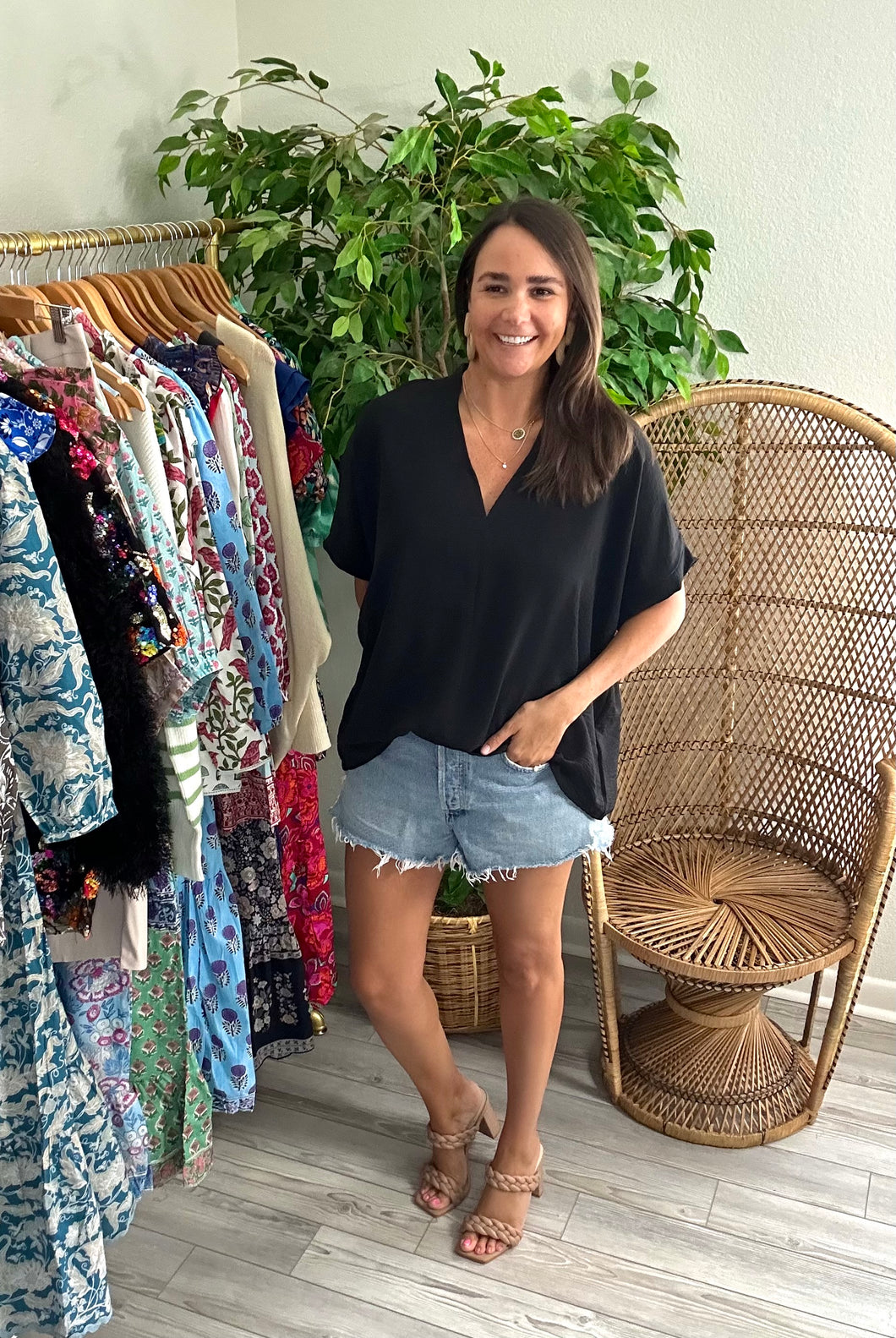 Classic oversized v-neck blouse with dolman sleeves in black. Poly silk blend. Covers most of front and rear fully.  Fits roomy, wearing size small.