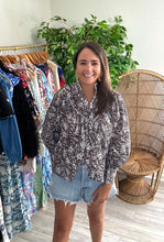 Load image into Gallery viewer, Brown and white paisley printed blouse with front functional buttons, balloon pleated sleeves, ladder lace trim on front and backside, pleated yoke and standing collar with trim. Light weight cotton, thin, wearing nude bra.  Covers most of front and backside but not all.  True to size, wearing size small.  Size up from extra length.
