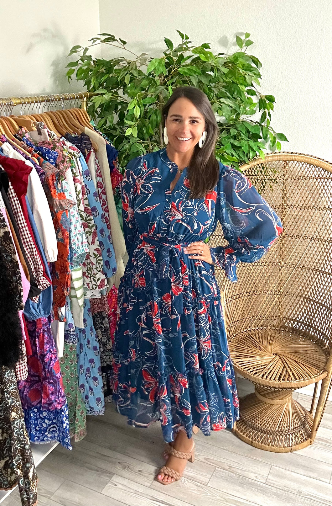 Teal and coral floral printed midi dress. Chiffon overlay with front functional buttons, tiered skirt with ruffle detailing and removable tie at waist. Button and ruffle detailing at wrist. Chiffon overlay and poly cotton blend underlay.  True to size, fits roomy, wearing size small.  Good for bump, post bump or no bump!