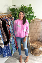 Load image into Gallery viewer, Orchid sweater with cheetahs. Slight high low hemline. Cotton knit blend.  Fits roomy, true to size, wearing size small.
