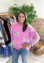 Load image into Gallery viewer, Orchid sweater with cheetahs. Slight high low hemline. Cotton knit blend.  Fits roomy, true to size, wearing size small.
