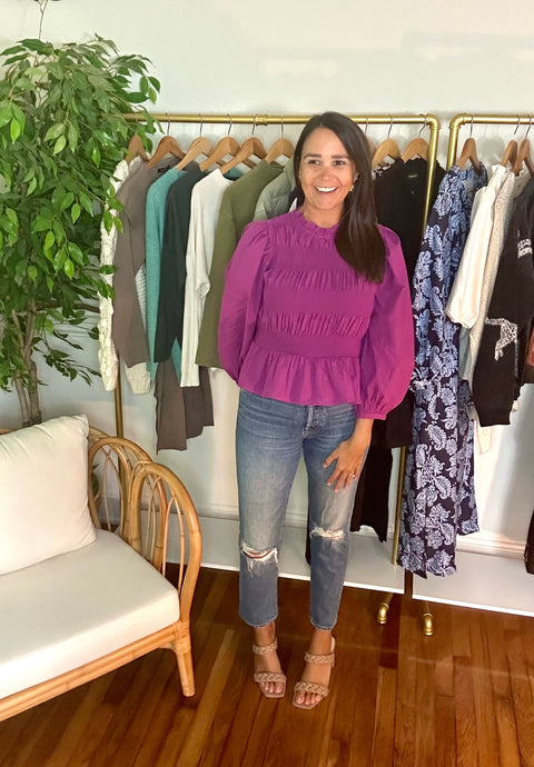 Boysenberry colored cotton poplin blouse. Puff sleeves, leveled smocking and peplum waistline. Back keyhole tie closure.  True to size, wearing size small.