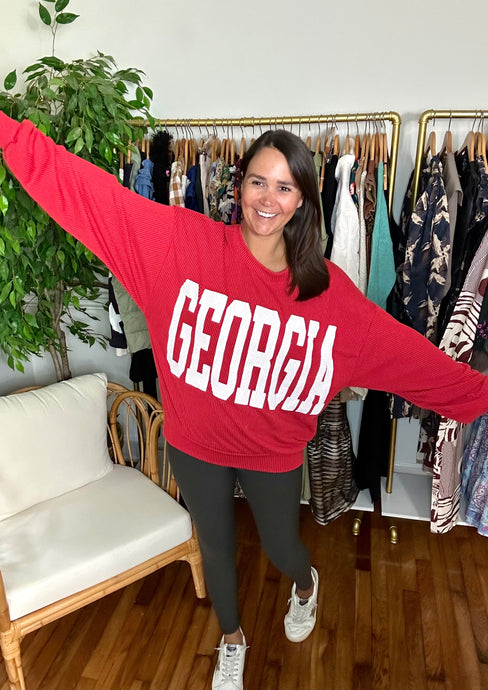 Georgia bright red sweatshirt. Oversized, ribbed and banded at bottom.  True to to size, fits roomy, wearing size small.