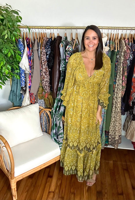 Paisley ruffle detailed maxi dress. Paisley print maxi dress with boho vibes. Fitted bodice with v-neck and flow skirt throughout. Long sleeves with exaggerated wrists with double ruffle detailing, elastic for placement. Citrus and hunter green throughout. Lined with sheer overlay. Back zipper and button closure. Bra friendly.  True to size, wearing size small.