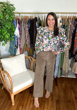 Load image into Gallery viewer, Mocha wide legged corduroy pants. High waisted with button and zipper closure. Back pockets, no front pockets and belt loop waist. Raw hemline. Stretchy cotton blend. Extremely flattering.  Wearing size small, if between sizes, size up.
