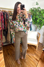 Load image into Gallery viewer, Mocha wide legged corduroy pants. High waisted with button and zipper closure. Back pockets, no front pockets and belt loop waist. Raw hemline. Stretchy cotton blend. Extremely flattering.  Wearing size small, if between sizes, size up.
