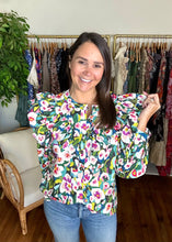 Load image into Gallery viewer, Bright multi colored floral printed button down blouse with double ruffle bodice at front and backside. Functional front buttons and wrist buttons. Covers most of front and backside. Light weight cotton poplin.  True to size, wearing size small.
