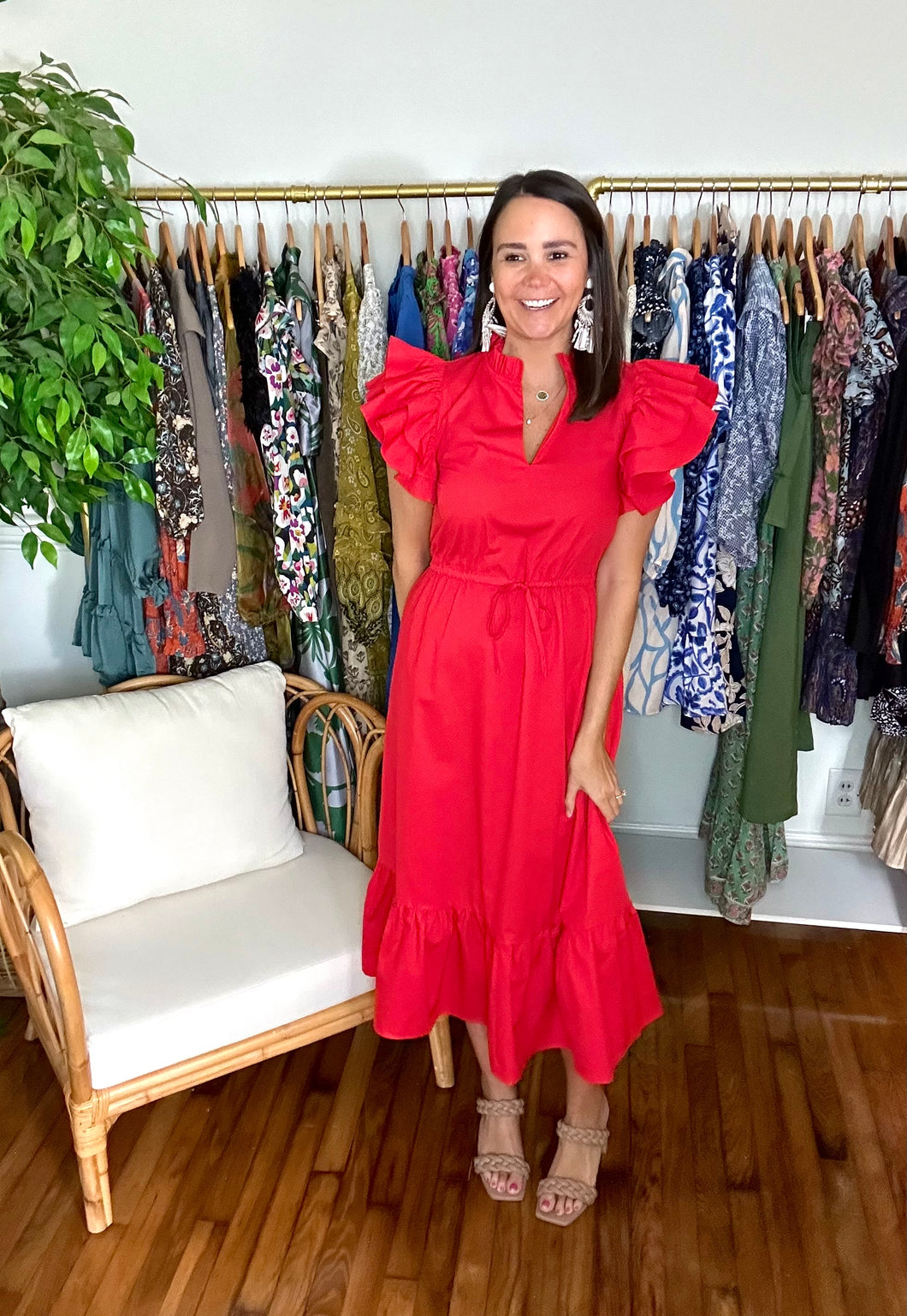 Bright red Miley Dillan midi dress. Drawstring at empire waist, double ruffle sleeves, split neckline with ruffle detailing. Straight skirt with drop ruffle hemline. Cotton Poplin.  True to size, wearing size x-small.  Good for bump, post bump or no bump!