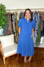 Load image into Gallery viewer, Mar Nova eyelet midi dress. Light weight cotton eyelet and lined. Dramatic puff sleeves, functional front buttons, straight skirt with drop ruffle hemline.  Fits roomy, if between sizes, size down. Wearing size x-small.  Good for bump, post bump or no bump!

