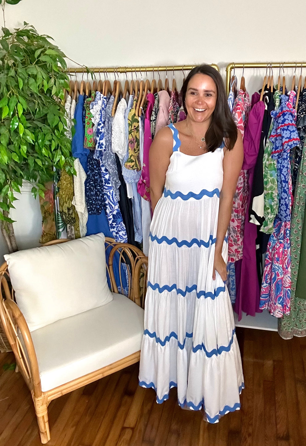 White cotton tiered maxi dress with blue rick rack detailing on straps and tiered skirt. Side zipper closure. Slip suggested.  True to size, wearing size small.  Good for bump, post bump or no bump!