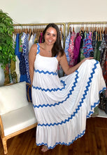 Load image into Gallery viewer, White cotton tiered maxi dress with blue rick rack detailing on straps and tiered skirt. Side zipper closure. Slip suggested.  True to size, wearing size small.  Good for bump, post bump or no bump!
