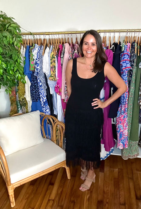 Black knit tank top dress with drop waistline and triple tiered tassel skirt.  True to size, wearing size small.