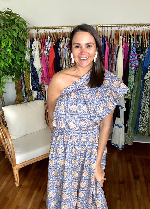 <p>One Shoulder top and skirt matching set. Double ruffle blouse with elastic neckline. A-line skirt with pockets and empire elastic waist line. Cotton poplin blend.</p> <p>Runs a little smaller, if between sizes, size up. Wearing size small.</p>