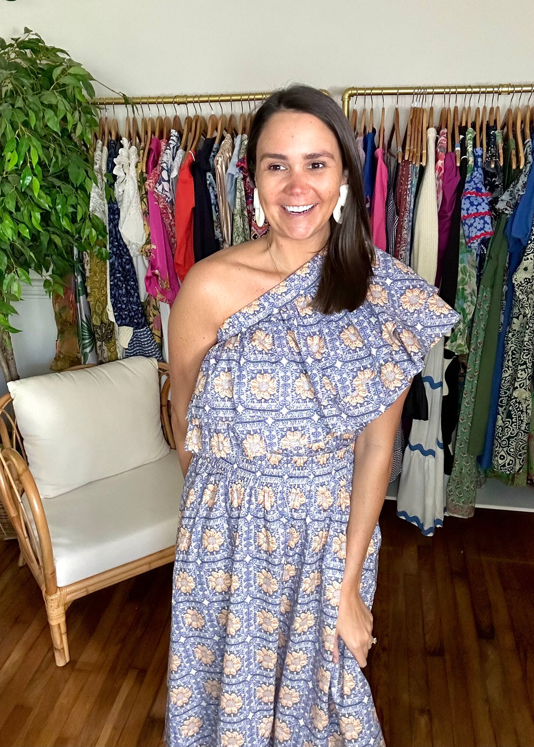 <p>One Shoulder top and skirt matching set. Double ruffle blouse with elastic neckline. A-line skirt with pockets and empire elastic waist line. Cotton poplin blend.</p> <p>Runs a little smaller, if between sizes, size up. Wearing size small.</p>