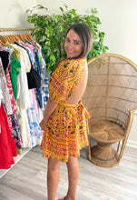 Load image into Gallery viewer, Fiesta mustard printed mini dress. Empire waist, backless back with button closure at neck. Back zipper closure and bow in back. Light weight cotton. Slip suggested.  Size up, wearing size medium.
