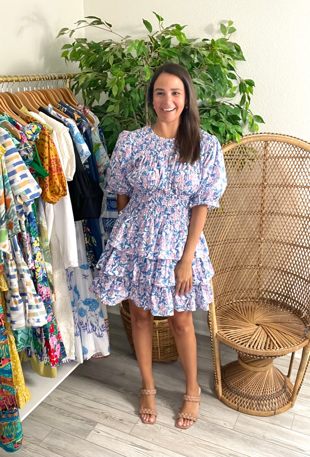 Floral printed blue and print mini dress. Ruffle detailing at neckline and sleeves. Triple tiered skirt with smocked bodice. Cotton blend.   True to size, wearing size small.