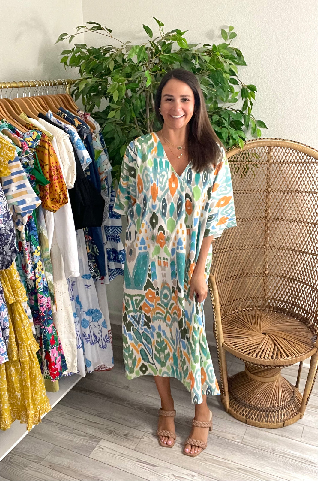 Abstract printed midi dress with modest plit v-neck and dolman sleeves. Slight v in back and slight high low hemline. Poly silk blend.  Dress down with sneakers or dress up for a wedding.  Runs oversized, wearing size small.  Good for bump, post bump or no bump!