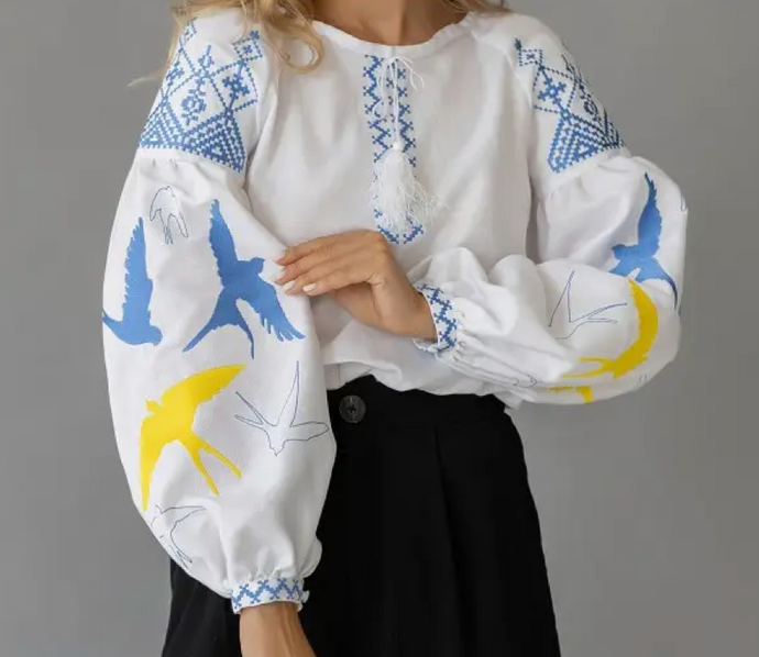 <p>Boho bird blouse with drop elbow balloon sleeves and crew neck. Embroidered birds and aztec pattern with faux front tie. Covers most of front and backside. Light weight cotton-linen blend.</p> <p>True to size, wearing size small.</p>