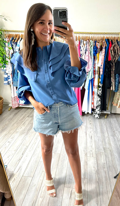 Triple ruffle Peter Pan collared blouse. Functional front buttons and ruffle cuff on sleeves. Elastic sleeves for placement. Covers some of front and rear but not all. Cotton stretch.  True to size, wearing size small.  For extra length, size up.