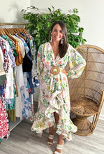 Load image into Gallery viewer, Chiffon floral print maxi dress. Snap closure throughout frontside and removable bamboo belt at waist. Wire trim to create flounce of the high-low skirt. Slit is high, slip skirt or dress suggested. Chiffon.  If between sizes, size up, wearing size small.
