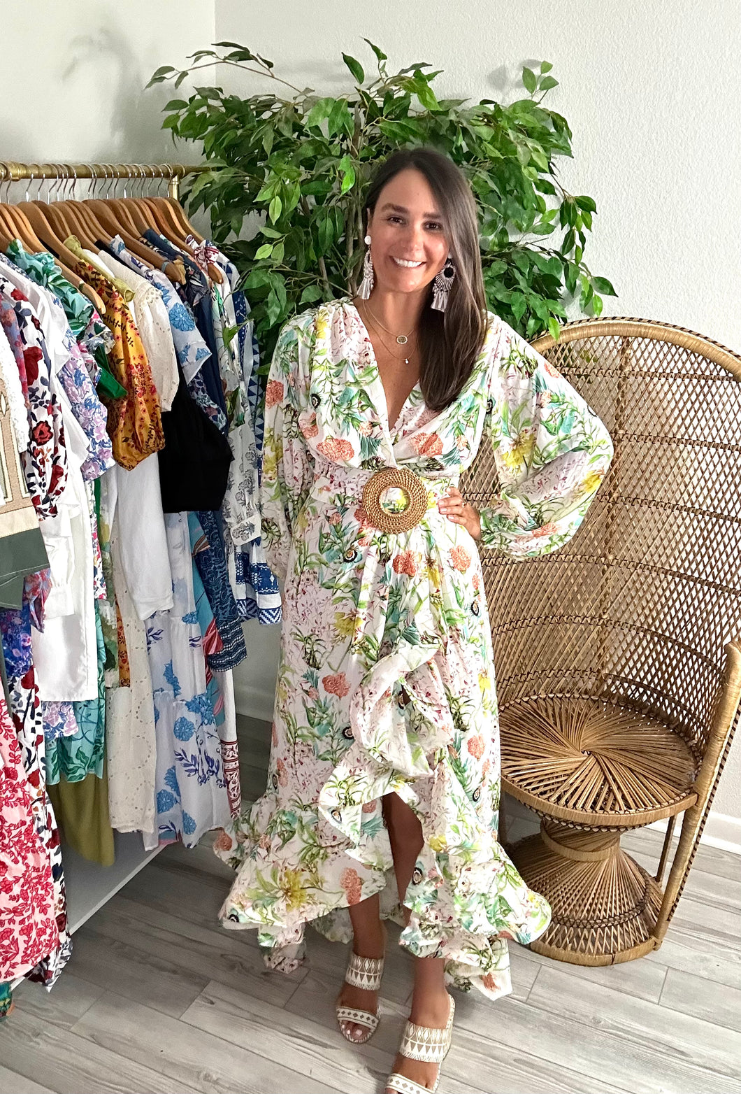 Chiffon floral print maxi dress. Snap closure throughout frontside and removable bamboo belt at waist. Wire trim to create flounce of the high-low skirt. Slit is high, slip skirt or dress suggested. Chiffon.  If between sizes, size up, wearing size small.