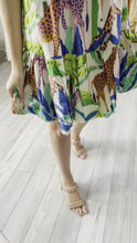 Load and play video in Gallery viewer, Jungle tropical print Kruger mini dress. Bubble skirt, bubble sleeves and square neckline. Light weight cotton poplin blend.  True to size, wearing size x-small.
