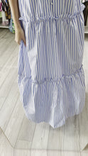 Load and play video in Gallery viewer, Blue and white thin striped maxi dress. Button front and tiered ruffle detailing throughout skirt. Fashion tape NOT needed. Back mirrors frontside. Poly silk blend.   True to size, wearing size small.  Good for bump, post bump or no bump!  Could be worn as a coverup
