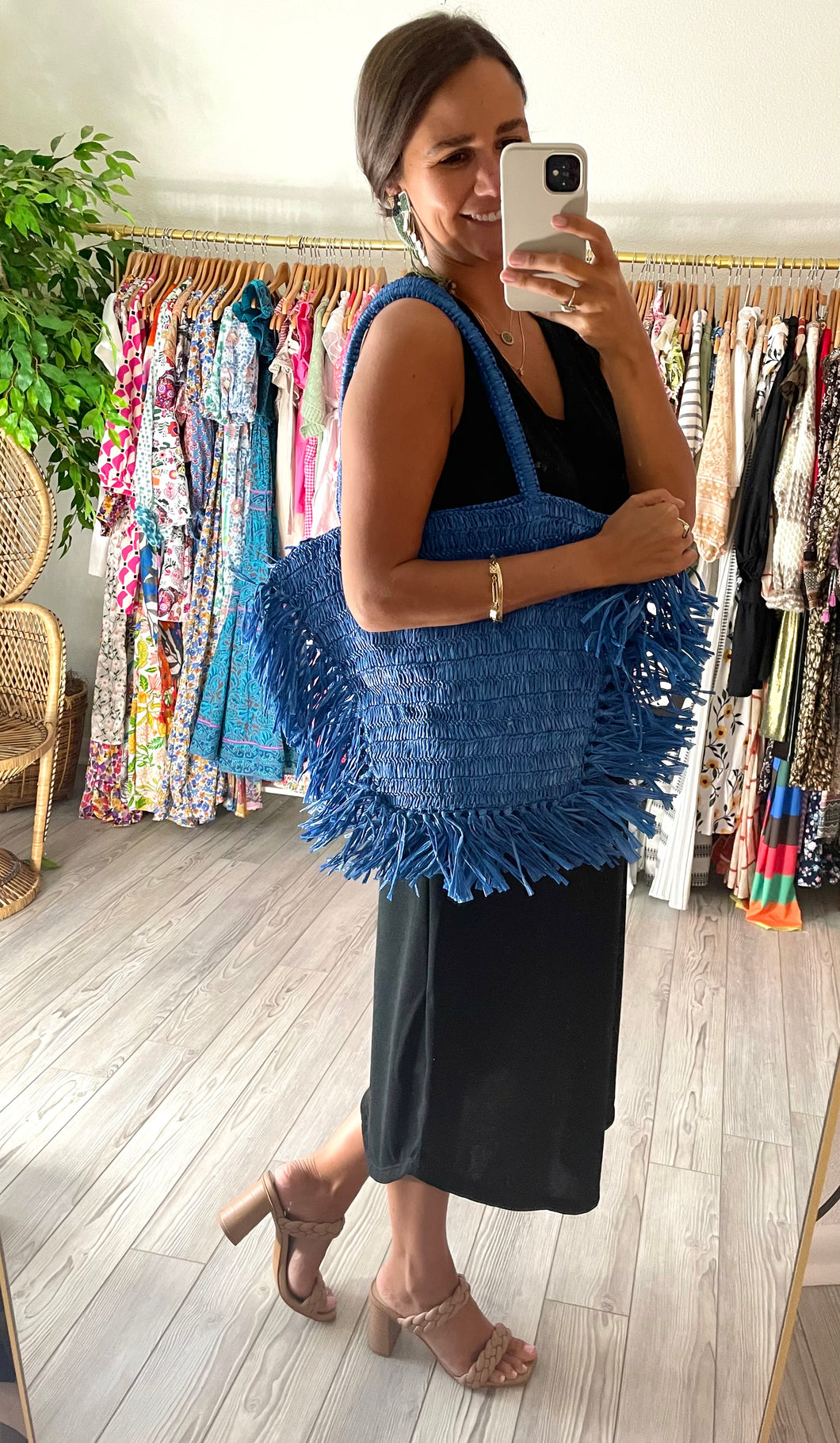 Cobalt straw tote with exaggerated fringe detailing. Extremely light weight.