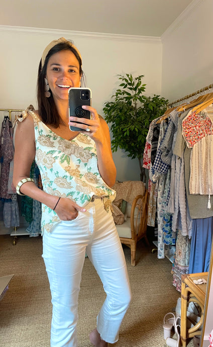 Fine cotton double lined floral blouse with contrasting pattern tie straps. Side slits for easy front tucking. Covers half of rear.   Works with dark and white denim for spring, summer and early fall.  True to size, wearing size x-small.