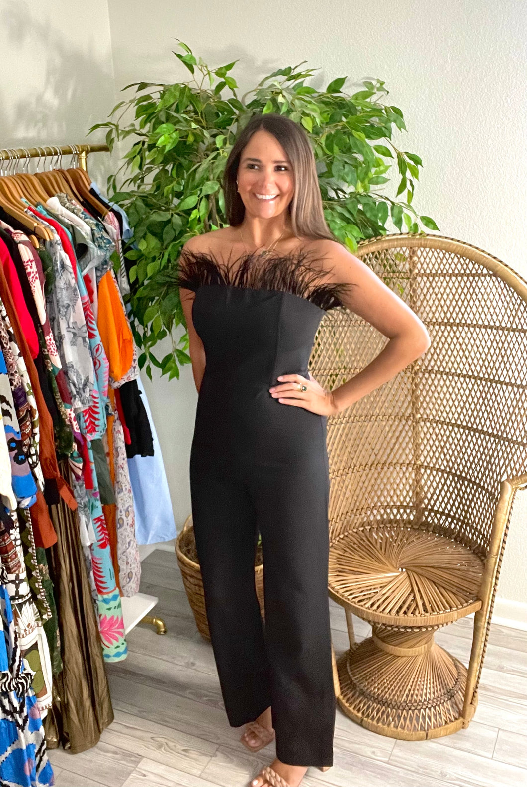 Jumpsuit with feather detailing on neckline. Back zipper closure, stretch in fabric.   If between sizes, size up, wearing size small.