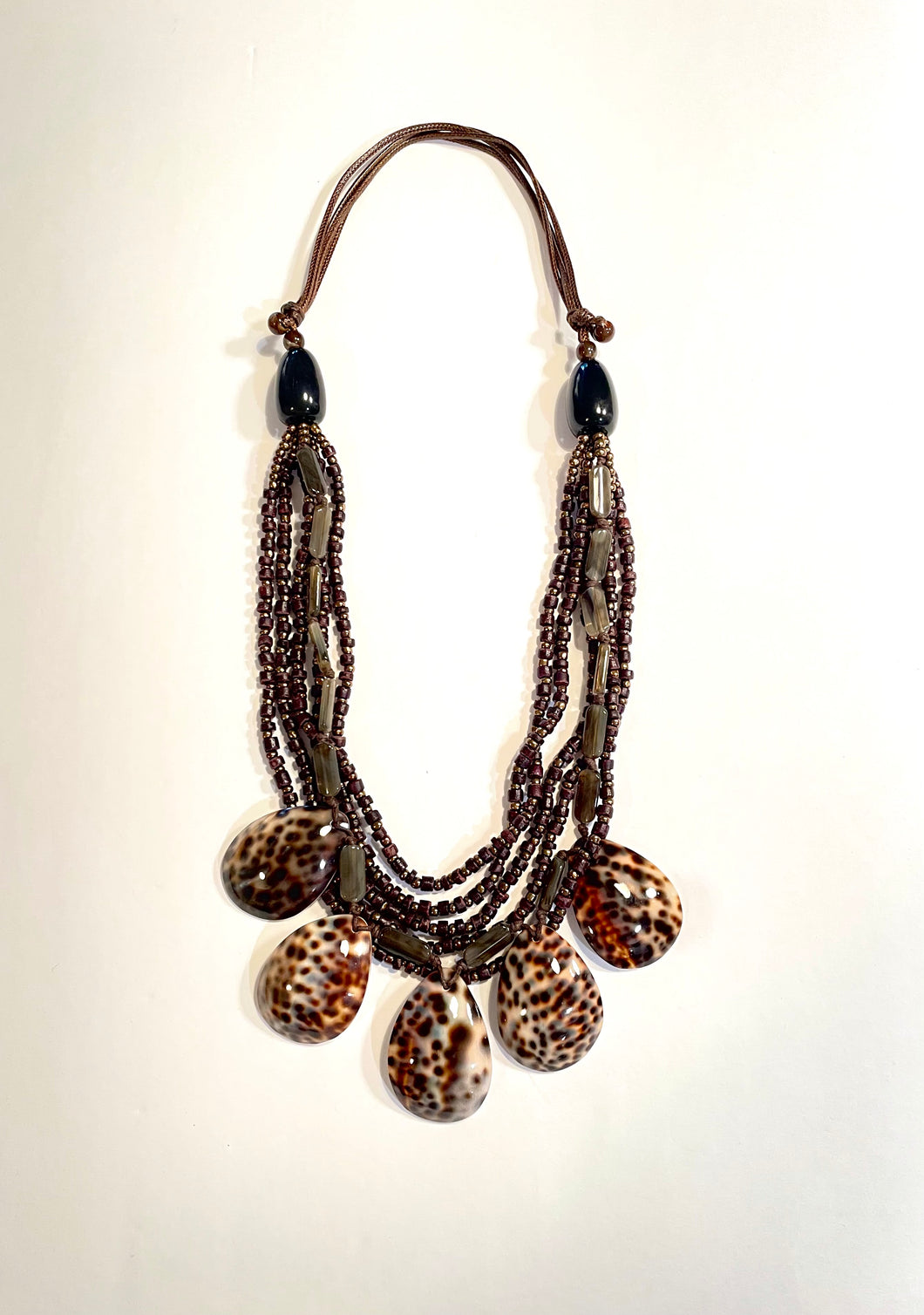 Tortoise shell and beaded bib necklace.